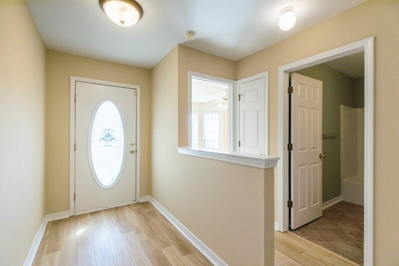 1607 Ella Ruth Drive Fort Walton Beach, FL 32547 - Photo 3 of 31 a view of a room with wooden floor and window