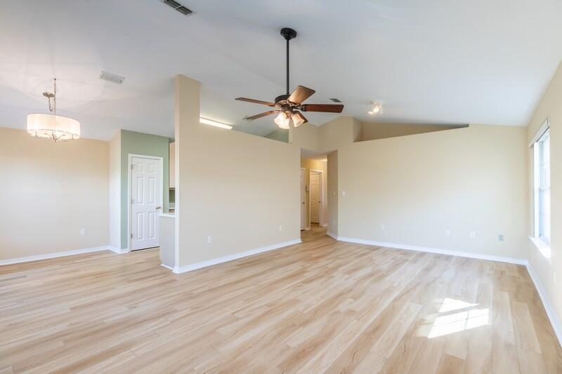 1607 Ella Ruth Drive Fort Walton Beach, FL 32547 - Photo 9 of 31 a view of an empty room with a chandelier fan