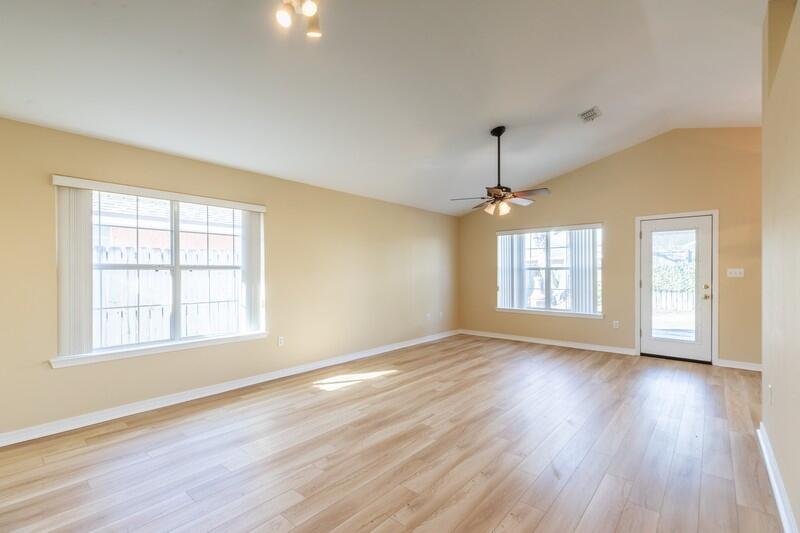 1607 Ella Ruth Drive Fort Walton Beach, FL 32547 - Photo 10 of 31 a view of an empty room with wooden floor and a window