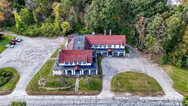 an aerial view of a house with a garden