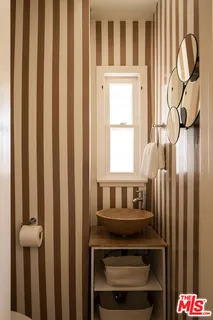 a spacious bathroom with a sink and a mirror