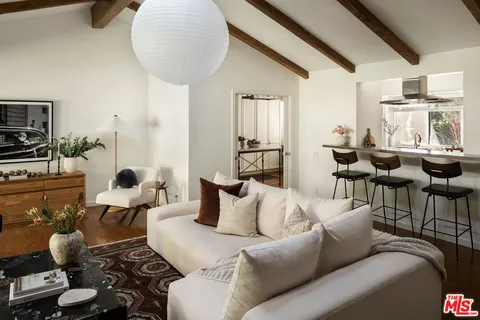 a bedroom with bed and a night stand