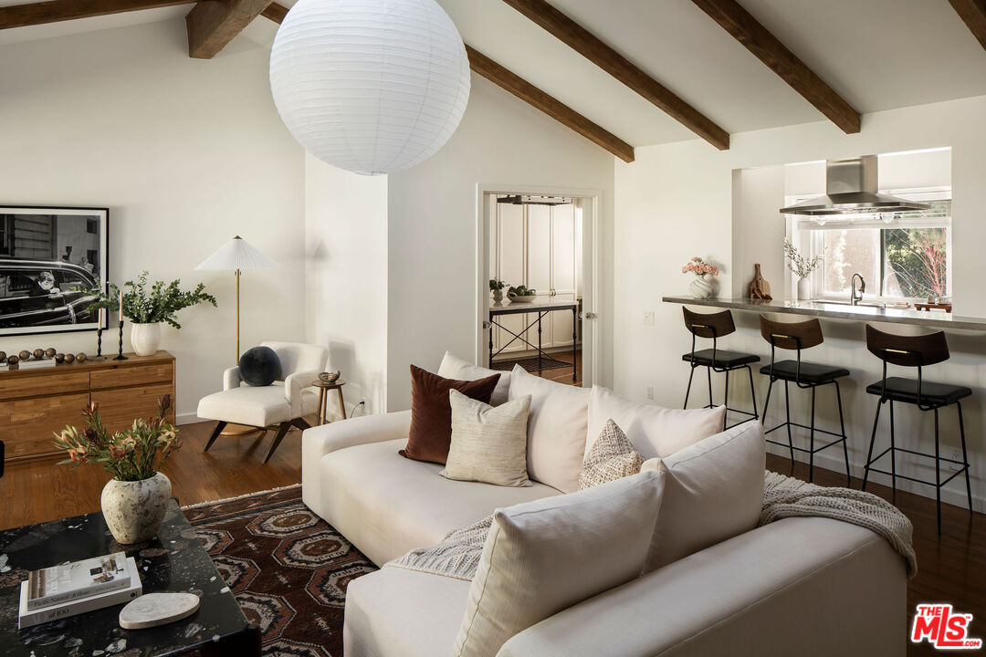 10225 Valley Spring Lane Toluca Lake, CA 91602 - Photo 20 of 35 a living room with furniture and wooden floor