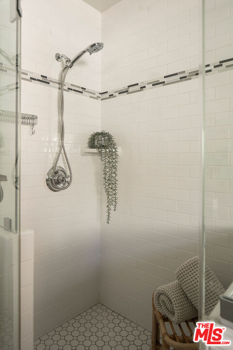 10225 Valley Spring Lane Toluca Lake, CA 91602 - Photo 23 of 35 a bathroom with a shower