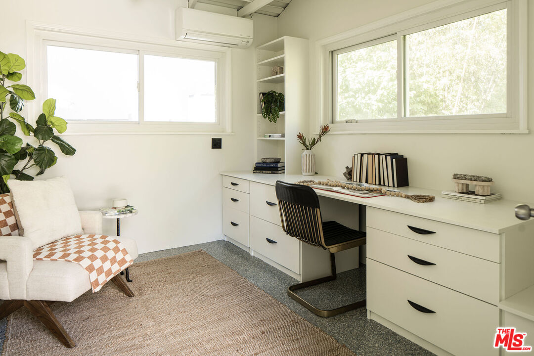 10225 Valley Spring Lane Toluca Lake, CA 91602 - Photo 25 of 35 a bedroom with a bed and a window