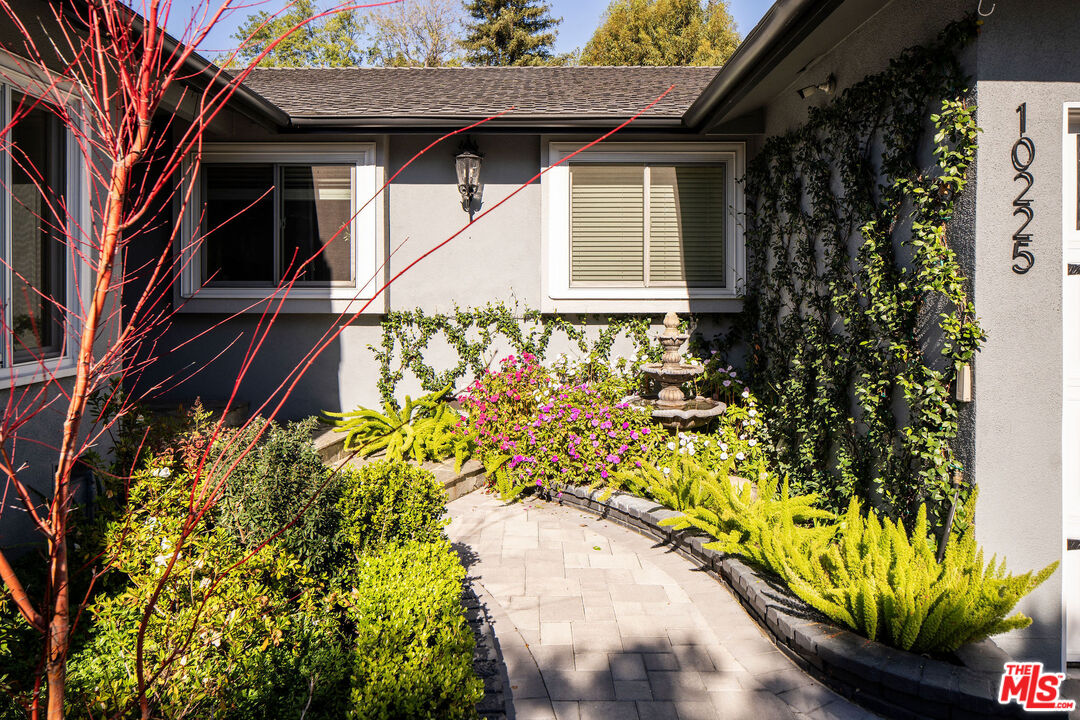 10225 Valley Spring Lane Toluca Lake, CA 91602 - Photo 33 of 35 a house with a flower garden