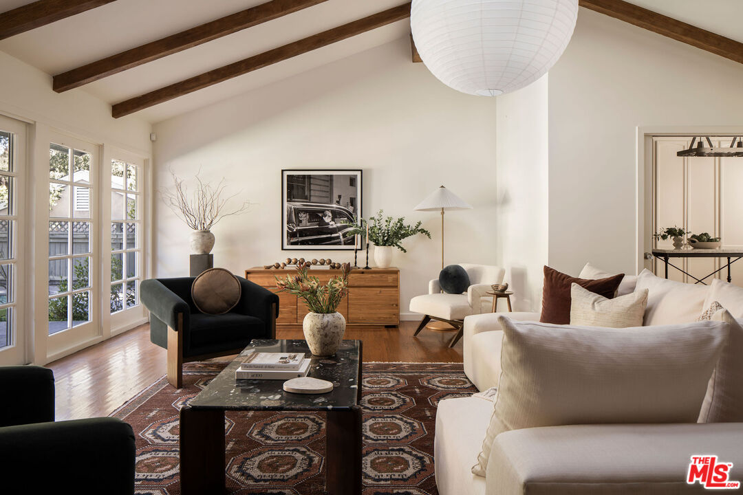 10225 Valley Spring Lane Toluca Lake, CA 91602 - Photo 5 of 35 a living room with furniture and a flat screen tv
