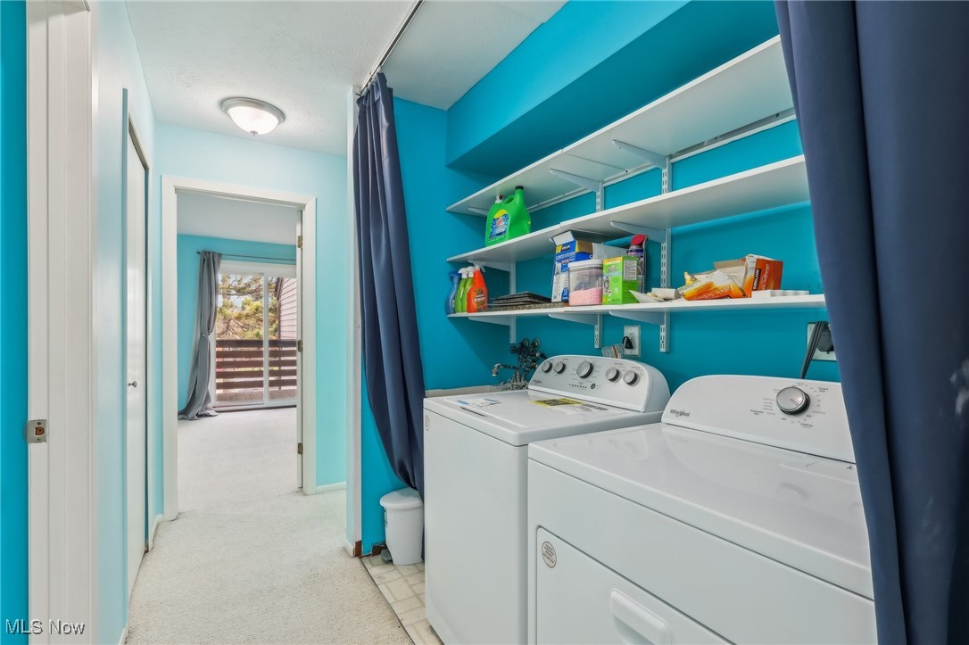 3484 Mayfield Road, Unit 3426 Cleveland Heights, OH 44118 - Photo 14 of 33 Laundry room featuring laundry area, separate washer and dryer, and light colored carpet