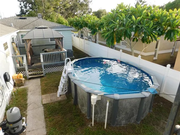 a view of a chairs and table in the patio