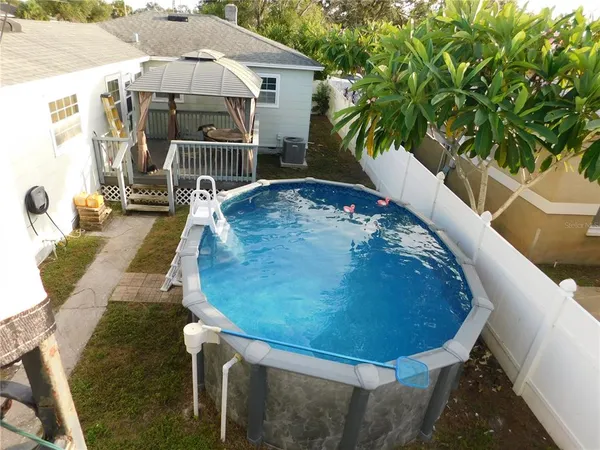 a view of a swimming pool with a patio
