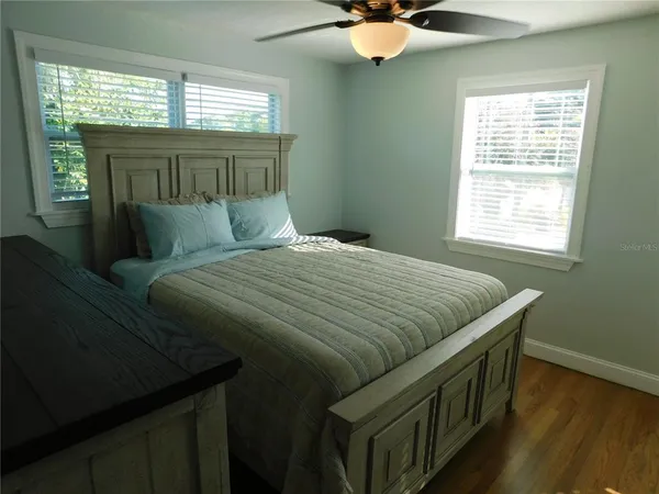 a bedroom with a bed and window