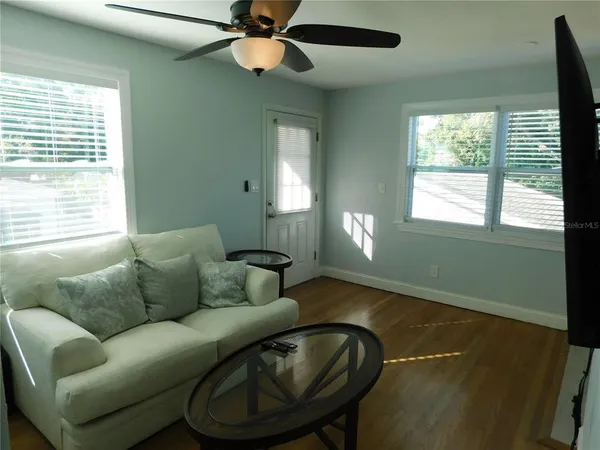 a living room with furniture and a window