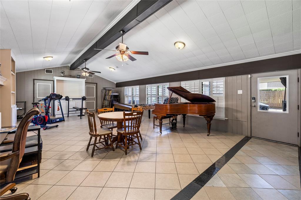 1300 Montclair Street Longview, TX 75601 - Photo 10 of 39 Dining room featuring light tile patterned floors, plenty of natural light, and a ceiling fan