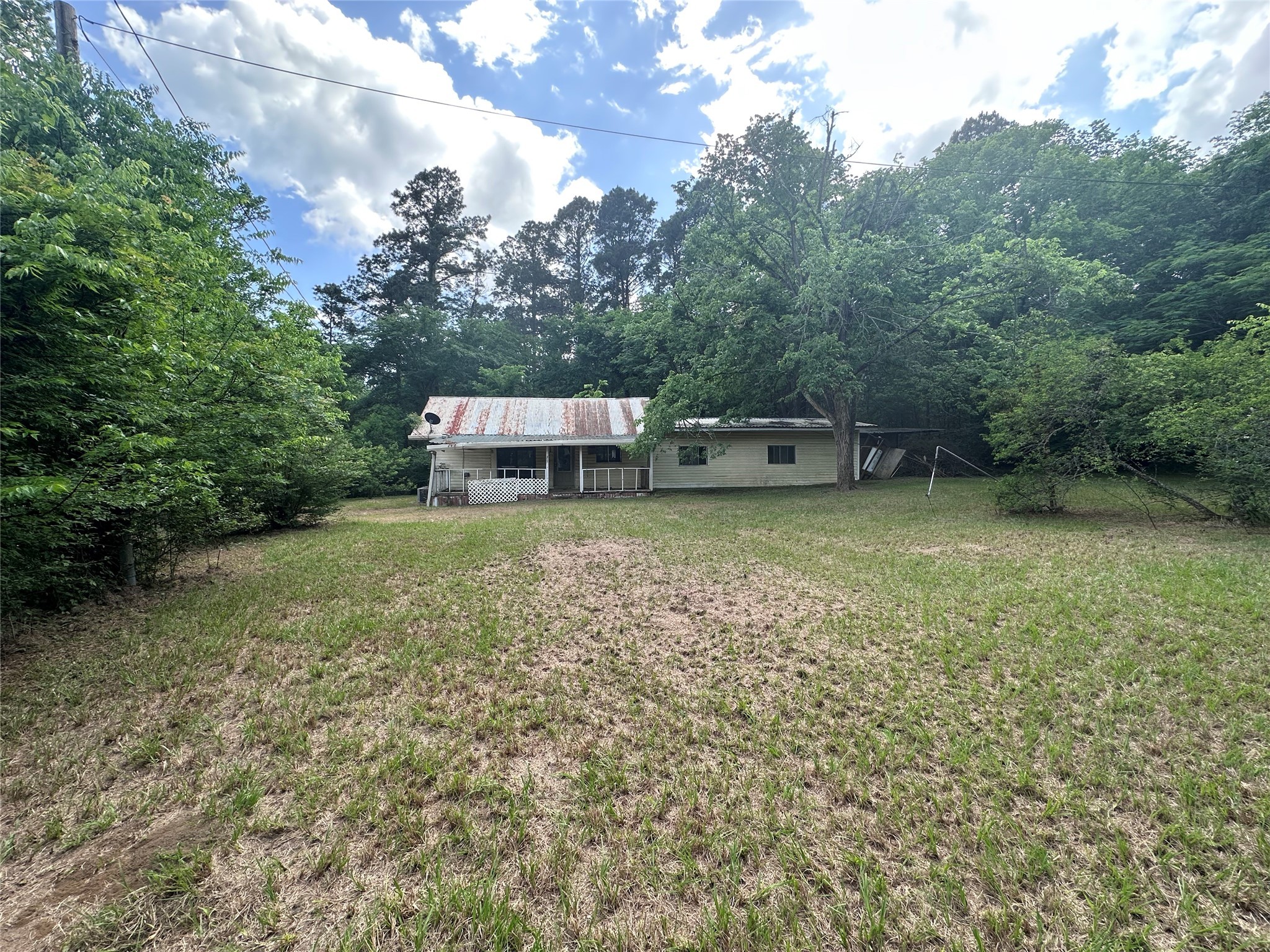 217 Box Factory Road Diboll, TX 75941 - Photo 3 of 14 a view of a house with a yard balcony and sitting area