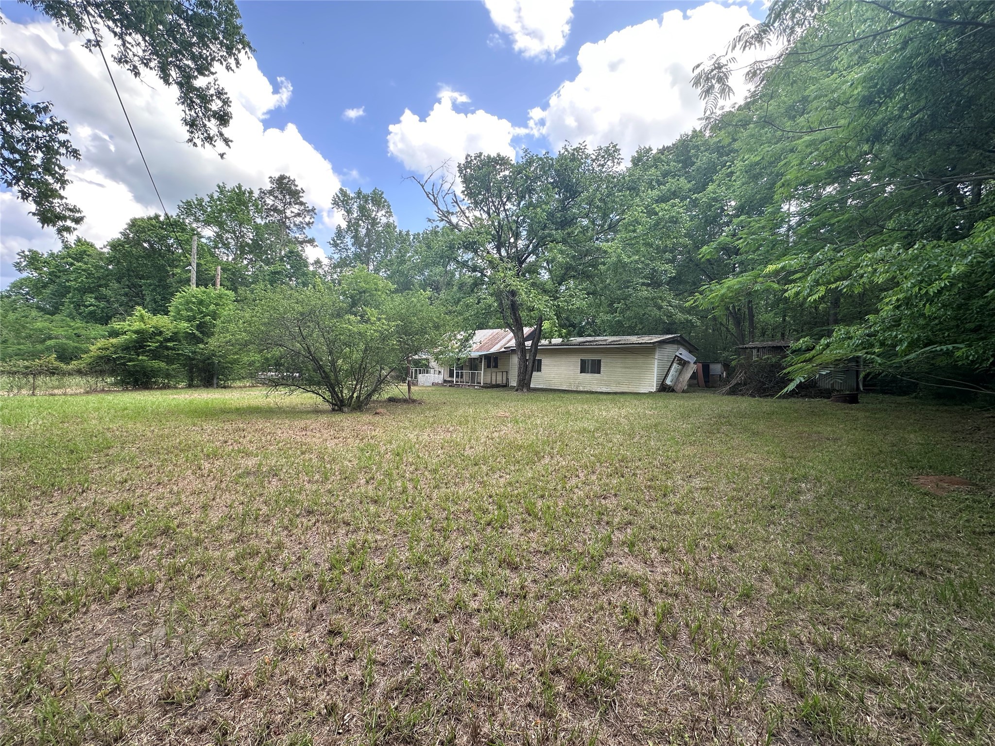 217 Box Factory Road Diboll, TX 75941 - Photo 4 of 14 a view of a couches and a table and chair in the green field