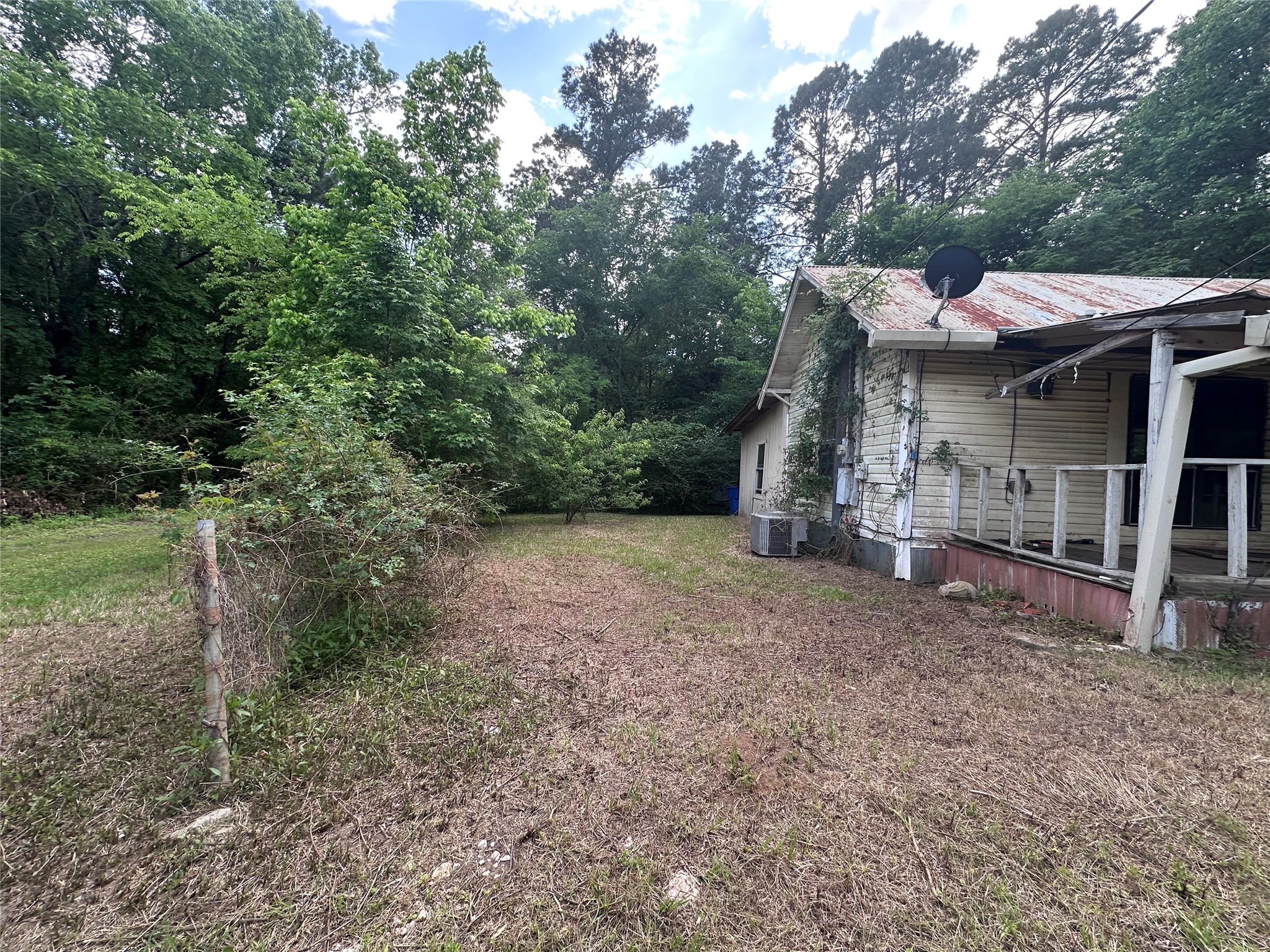217 Box Factory Road Diboll, TX 75941 - Photo 6 of 14 a view of a house with a backyard