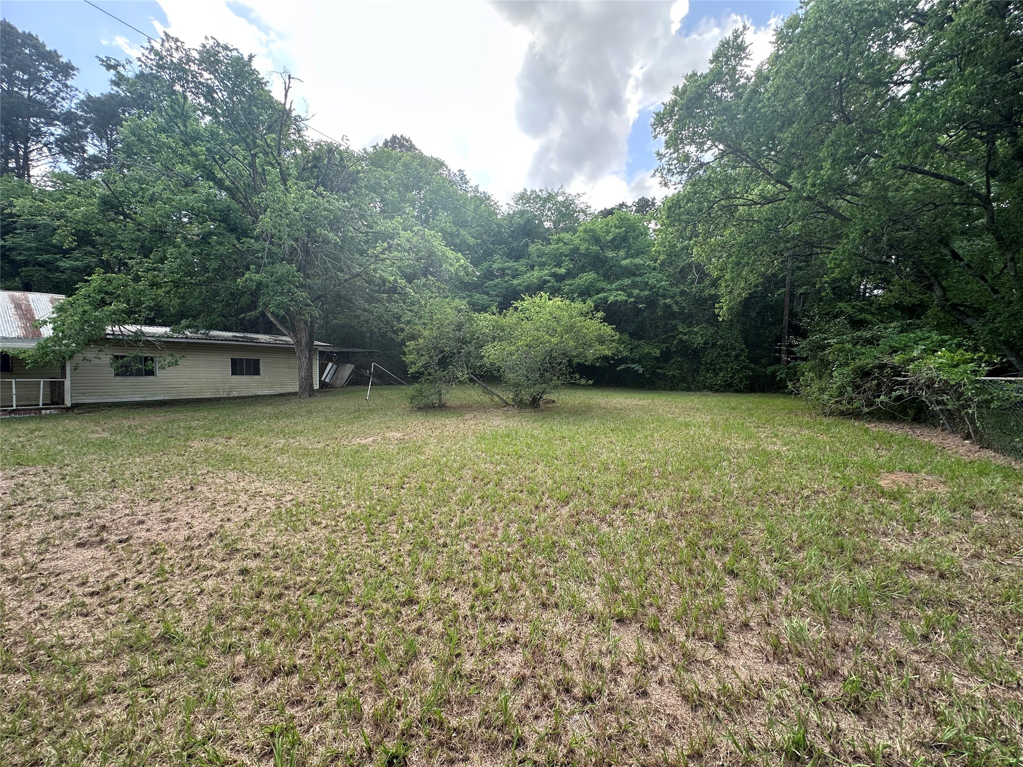 217 Box Factory Road Diboll, TX 75941 - Photo 7 of 14 a view of a green field with trees in the background