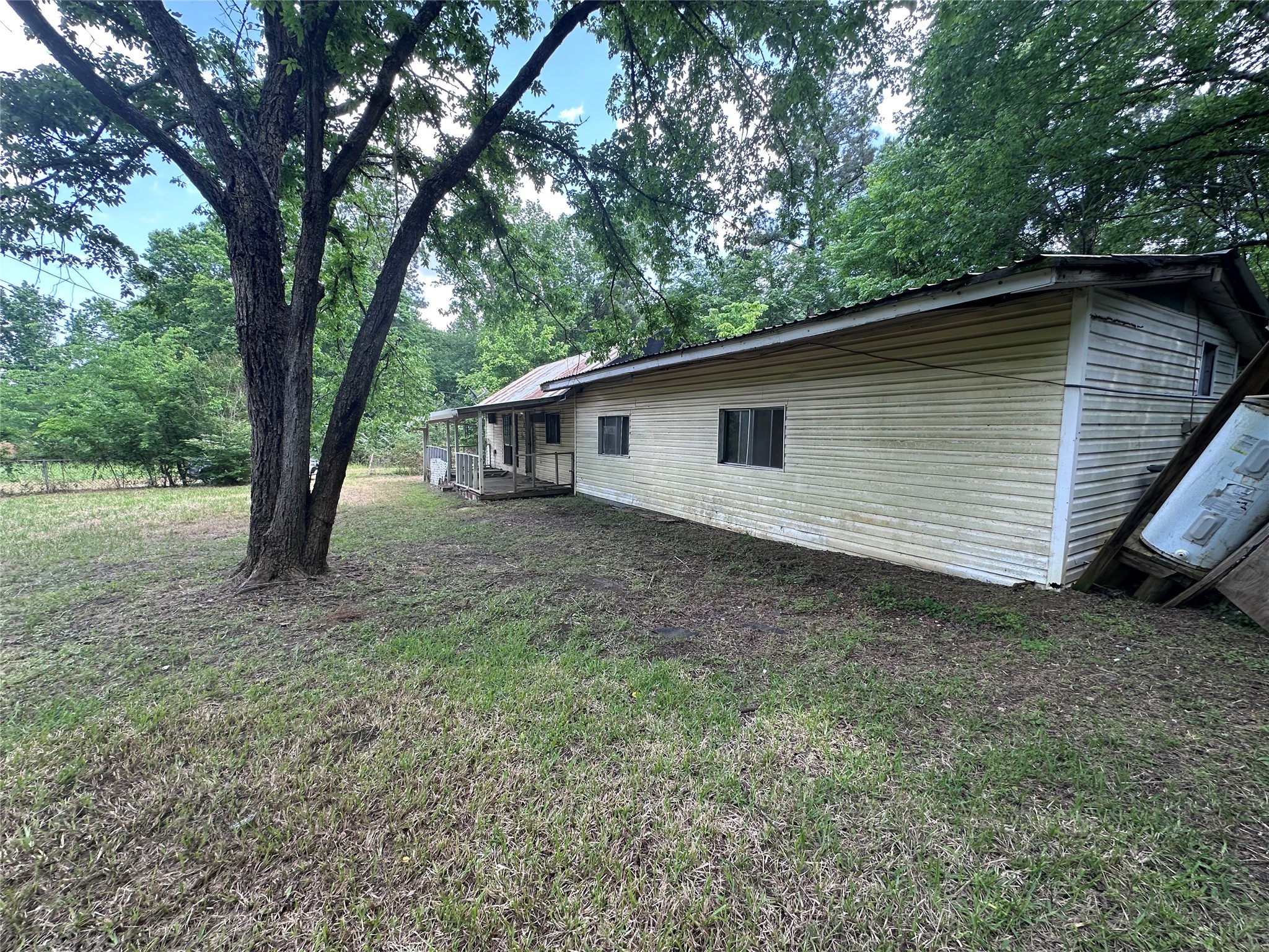 217 Box Factory Road Diboll, TX 75941 - Photo 9 of 14 a backyard of a house with lots of green space
