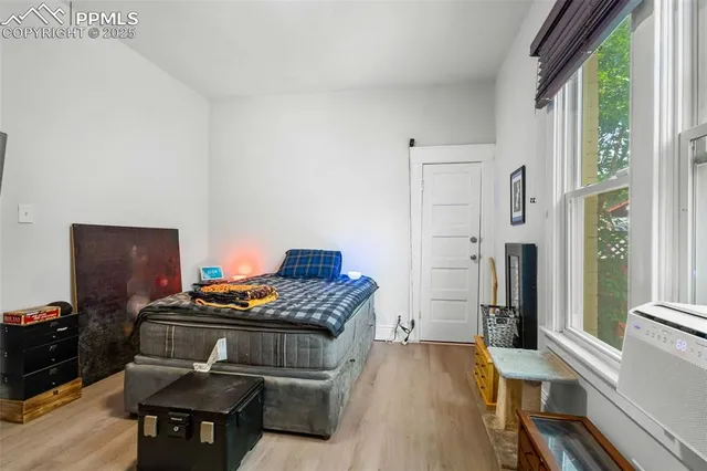 a kitchen that has a stove and a wooden floor
