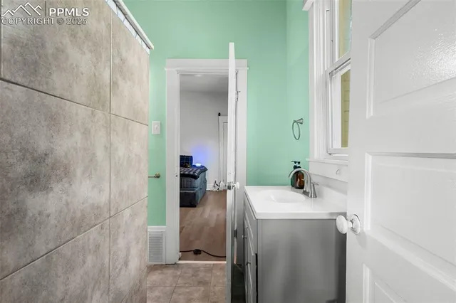 a bathroom with a sink and mirror