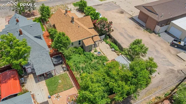 an aerial view of house with yard
