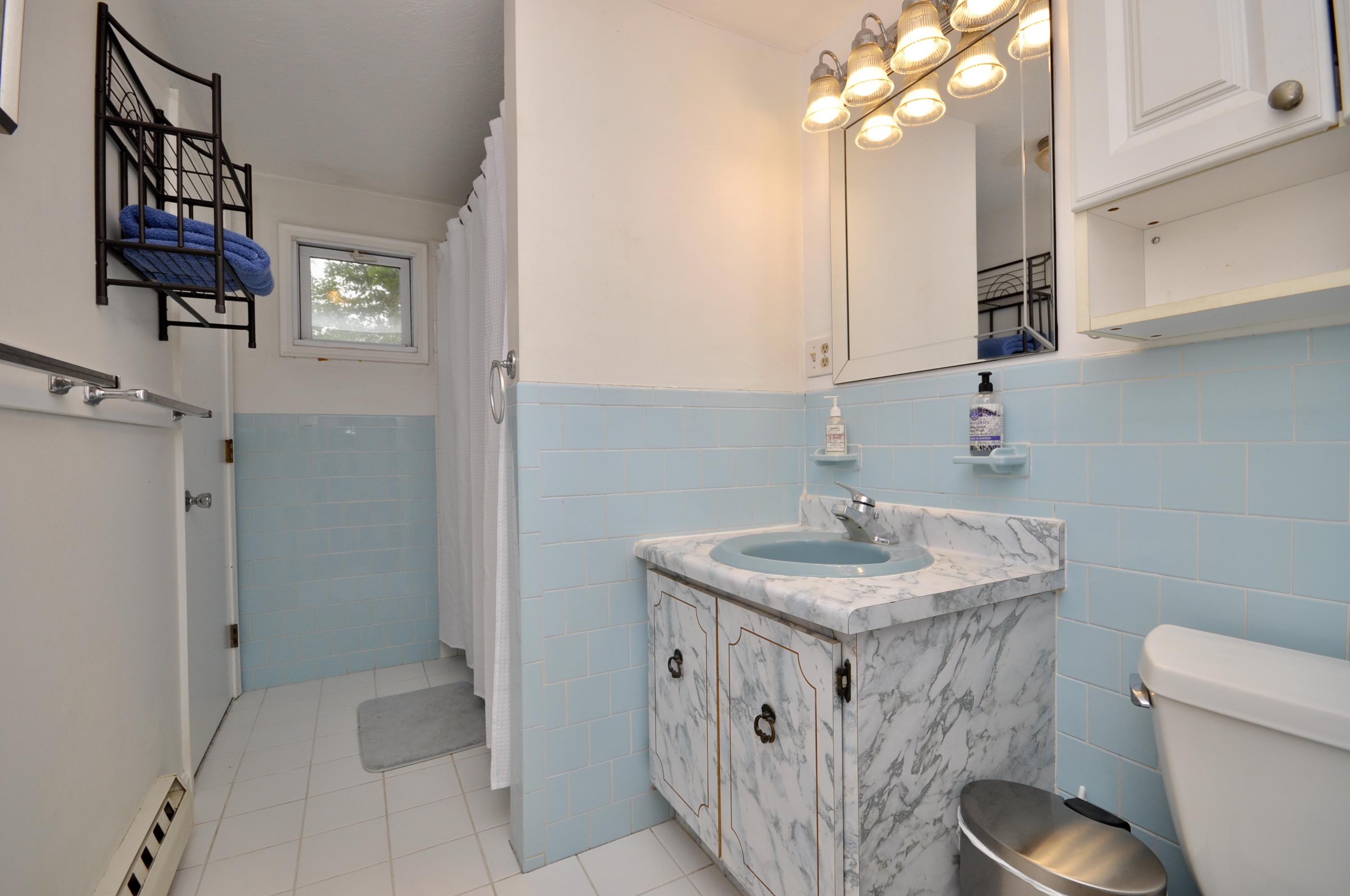 401 Village Drive Bourne, MA 02532 - Photo 12 of 22 a bathroom with a sink toilet and shower