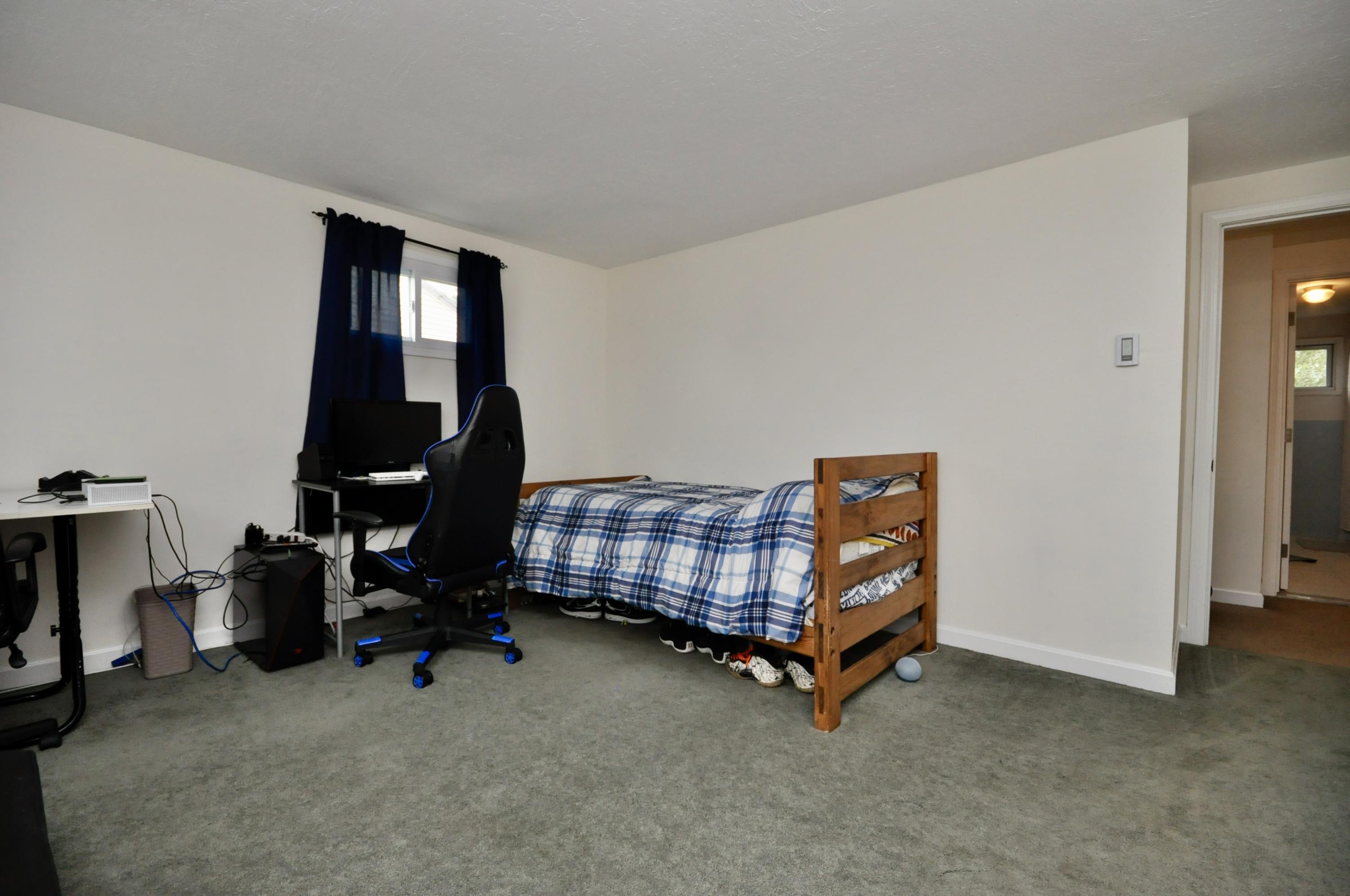 401 Village Drive Bourne, MA 02532 - Photo 14 of 22 a room with chair and gym equipment