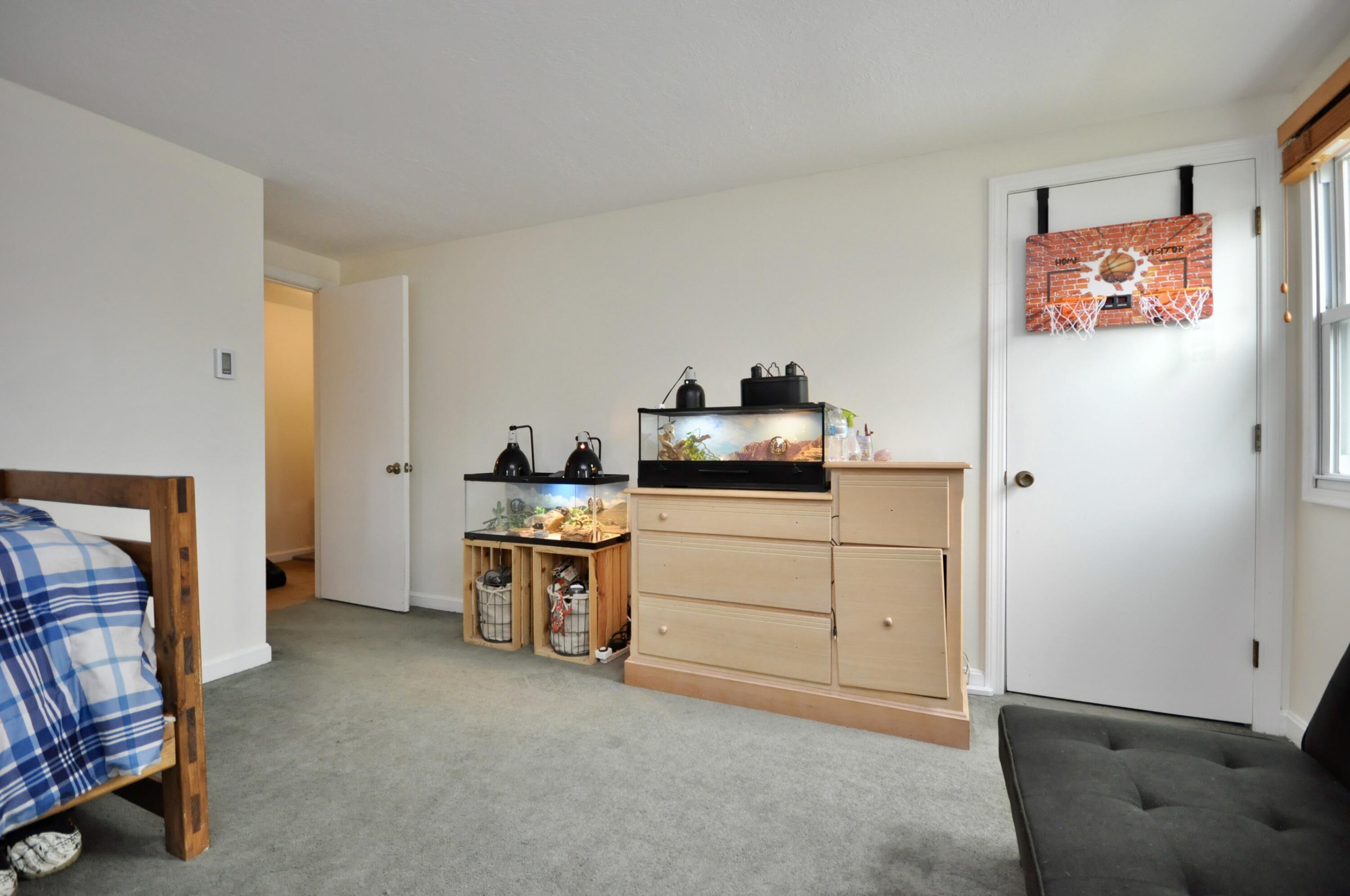 401 Village Drive Bourne, MA 02532 - Photo 15 of 22 a room with furniture a washer and dryer