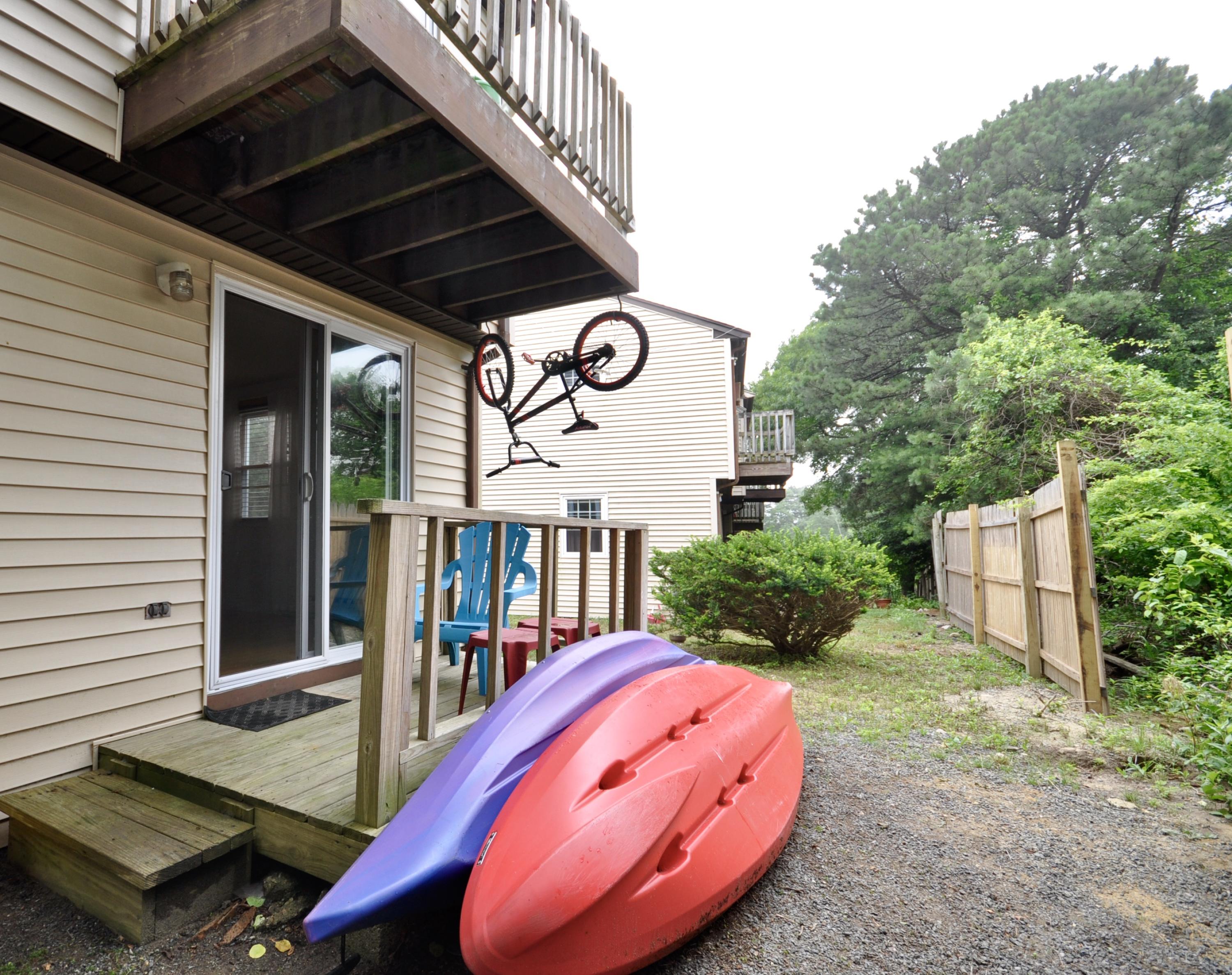 401 Village Drive Bourne, MA 02532 - Photo 19 of 22 a view of a chairs and table in the patio