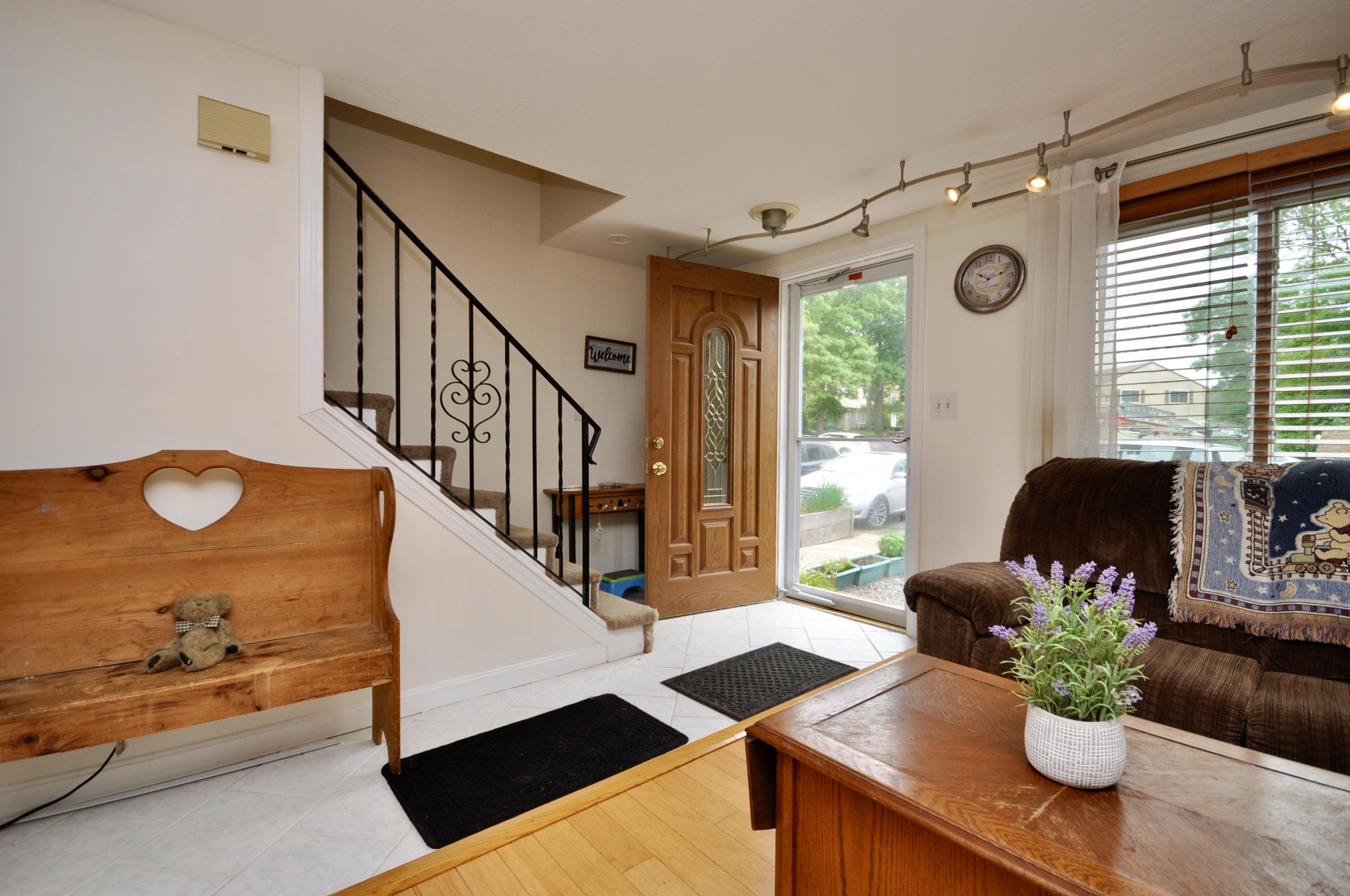 401 Village Drive Bourne, MA 02532 - Photo 4 of 22 a living room with furniture and a potted plant