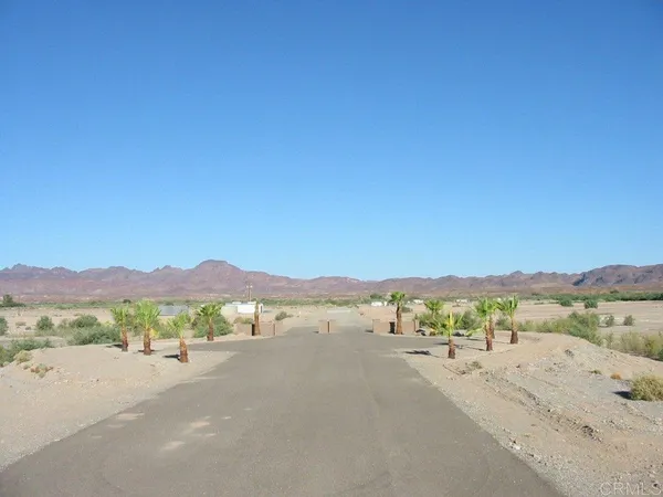 a view of a road with an ocean view