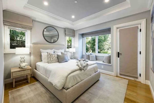 a bedroom with bed and a window