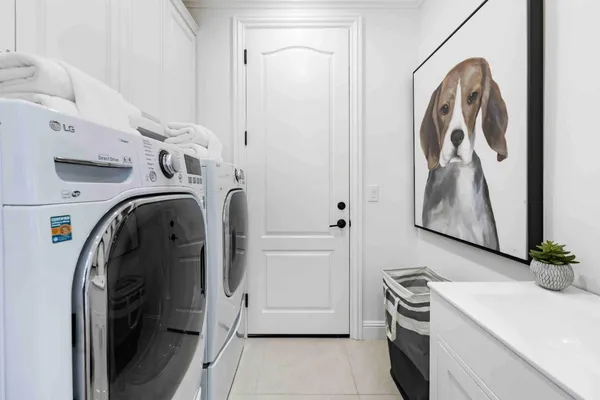 a utility room with dryer and washer