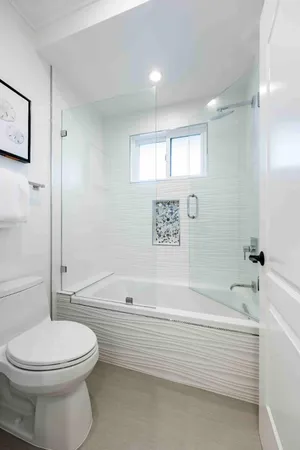 a bathroom with a sink a toilet and a bathtub