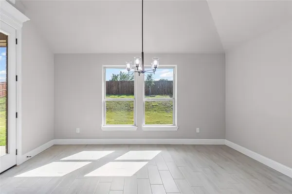 a view of a room with window and chandelier