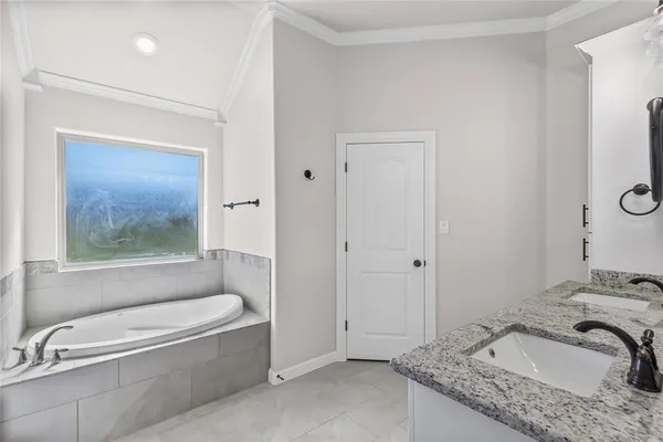 a bathroom with a granite countertop sink mirror and double