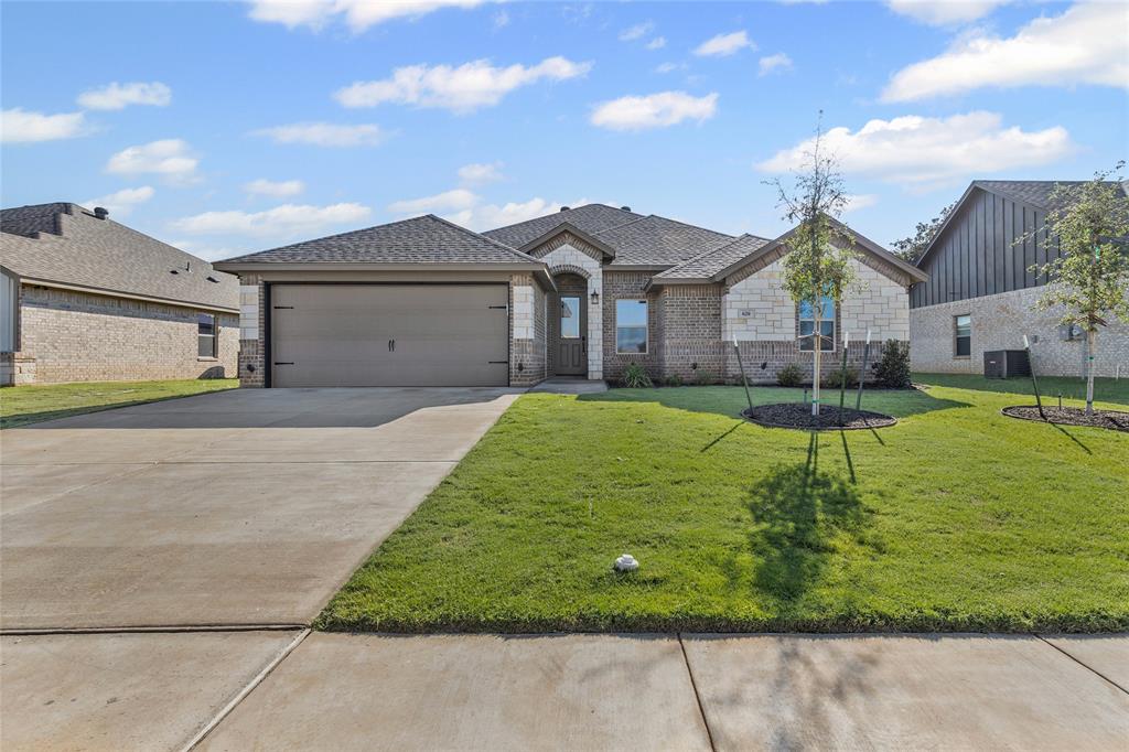 620 Jameson Springtown, TX 76082 - Photo 4 of 37 a house view with a garden space