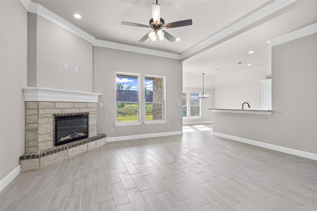 620 Jameson Springtown, TX 76082 - Photo 7 of 37 a view of an empty room with a fireplace and a window