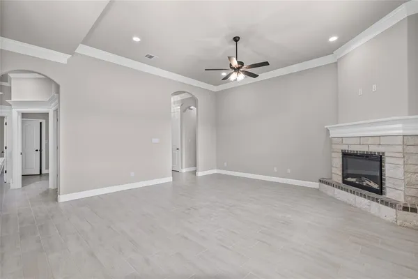 a view of an empty room with a fireplace