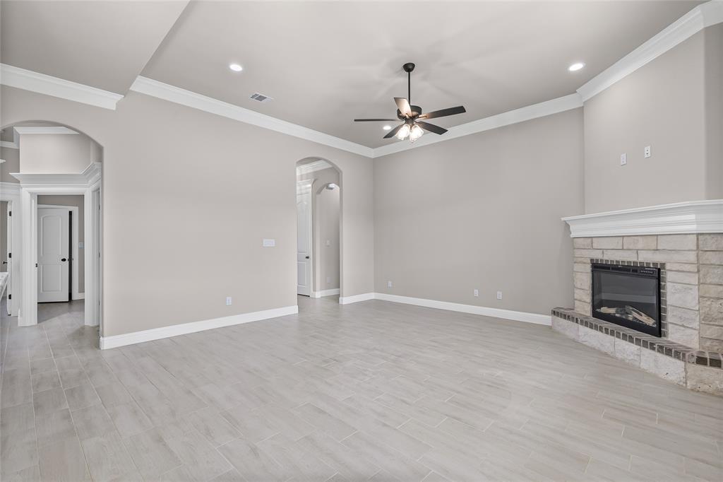 620 Jameson Springtown, TX 76082 - Photo 9 of 37 a view of an empty room with a fireplace