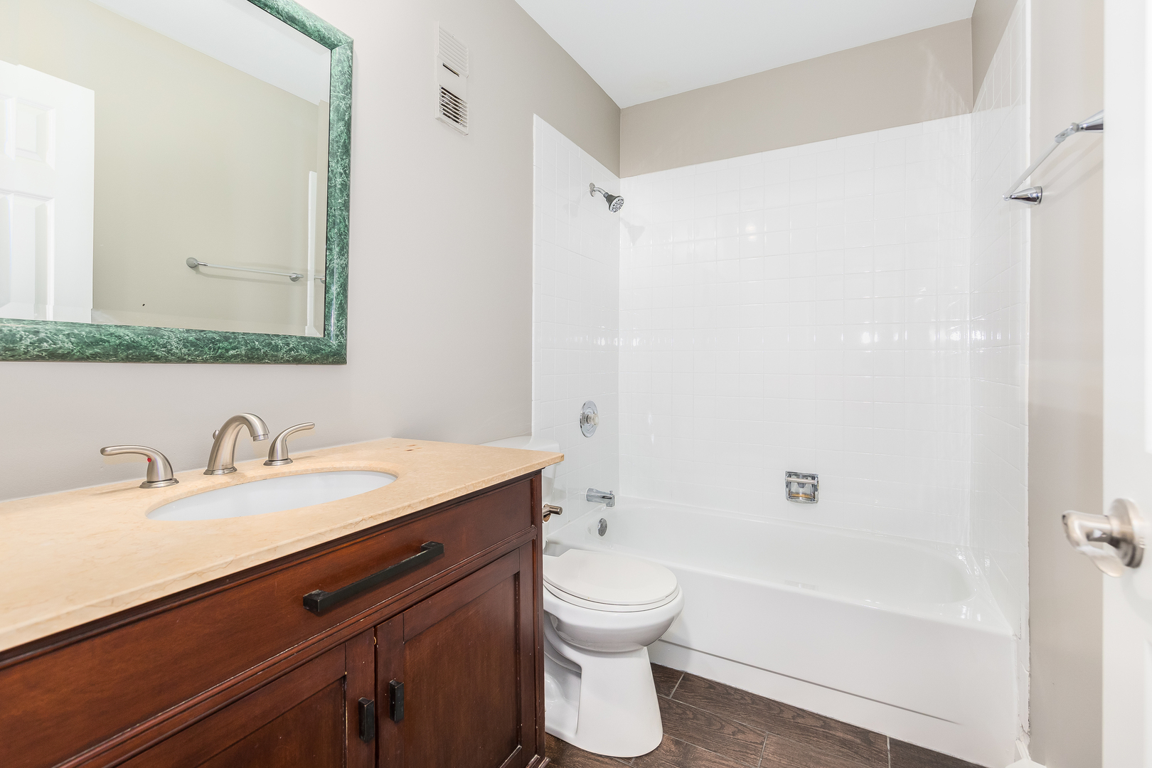 2525 Spring Street, Unit 2806 Woodridge, IL 60517 - Photo 4 of 16 a bathroom with a granite countertop sink toilet and shower