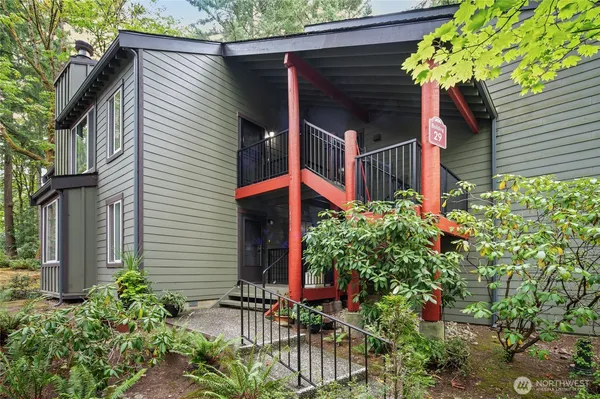 a view of a house with a yard and table and chair