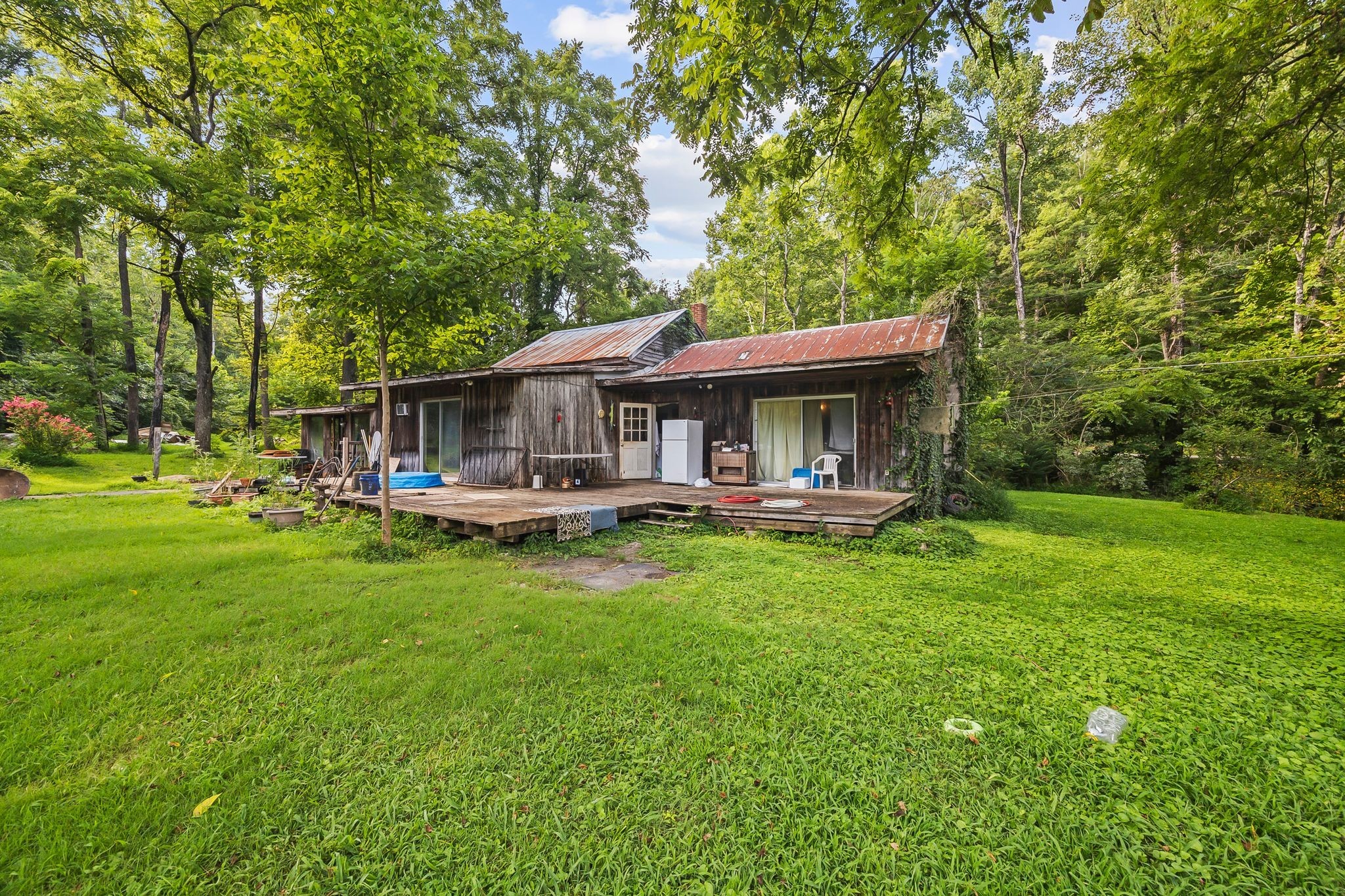 1150 Bell Hollow Road Vanleer, TN 37181 - Photo 13 of 32 a front view of a house with yard patio and green space