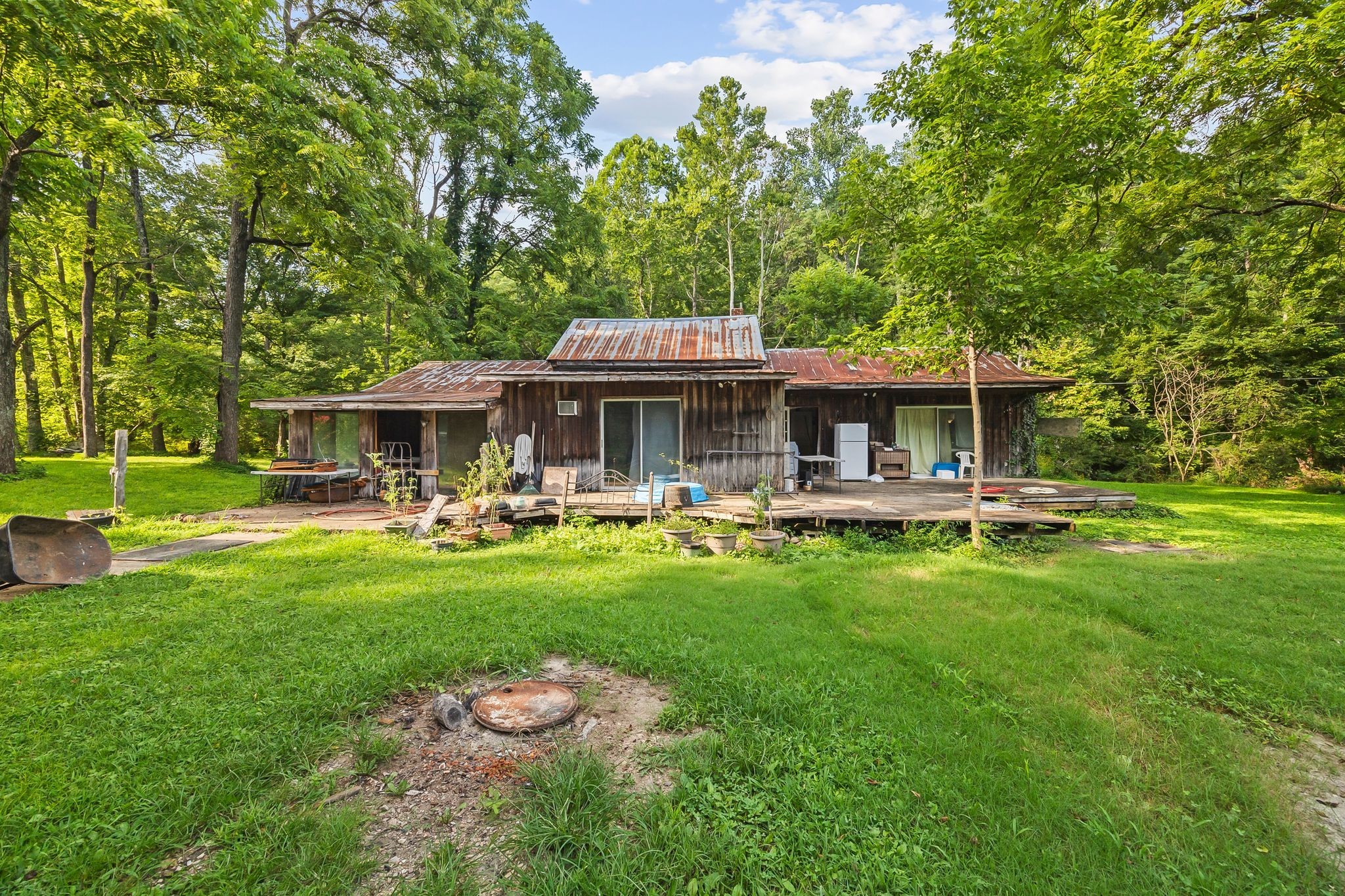 1150 Bell Hollow Road Vanleer, TN 37181 - Photo 14 of 32 a front view of a house with swimming pool having outdoor seating