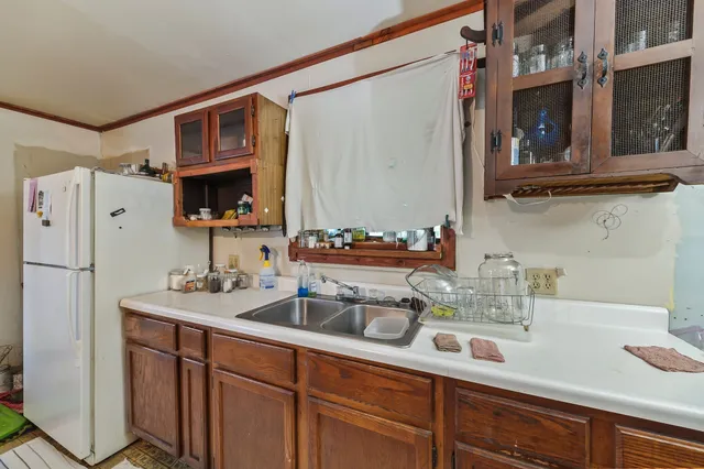 a kitchen with stainless steel appliances a sink and cabinets