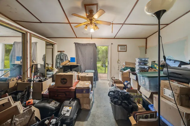 a room with gym equipment and a large window