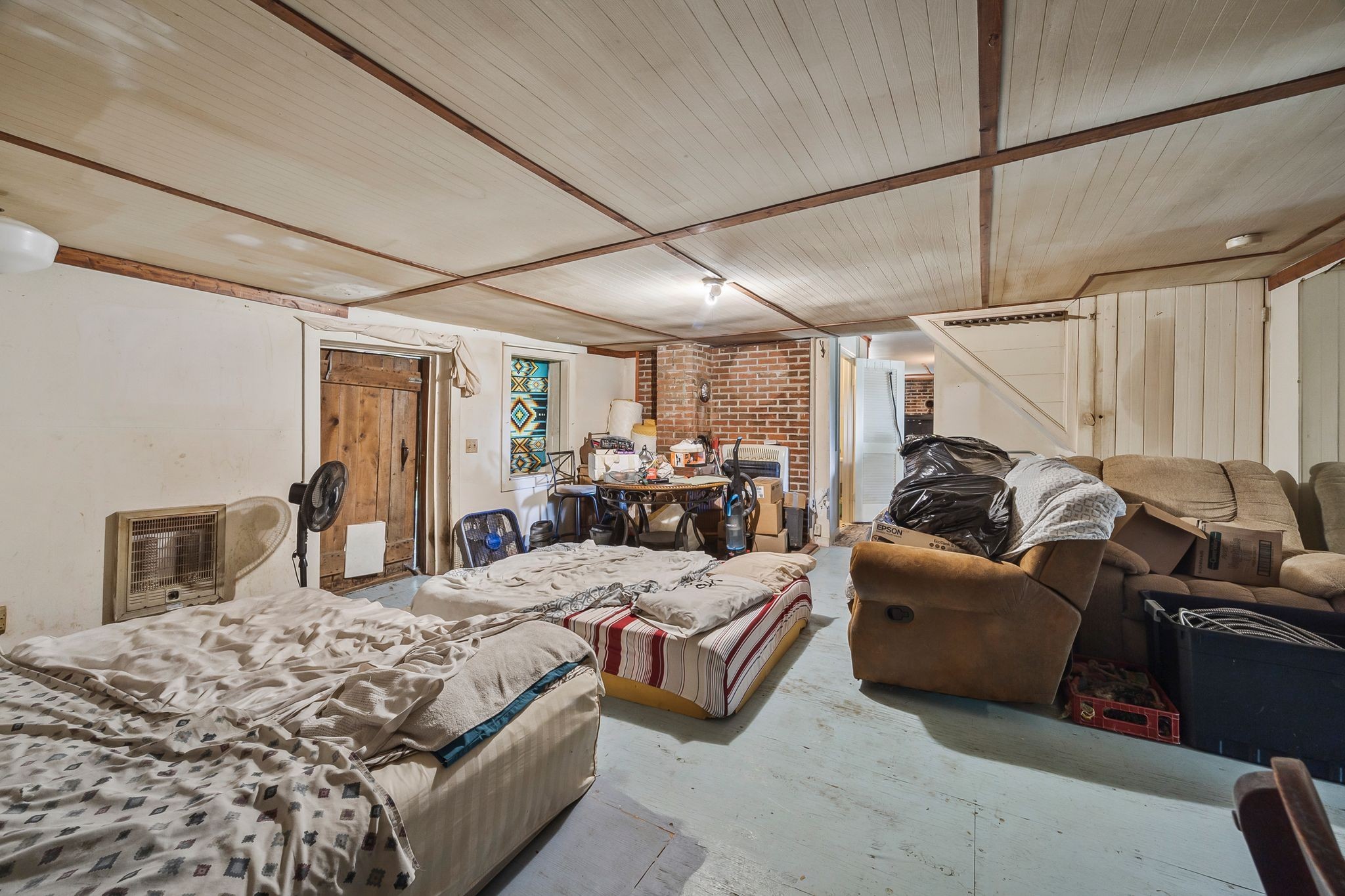 1150 Bell Hollow Road Vanleer, TN 37181 - Photo 20 of 32 a bedroom with bed couch and window