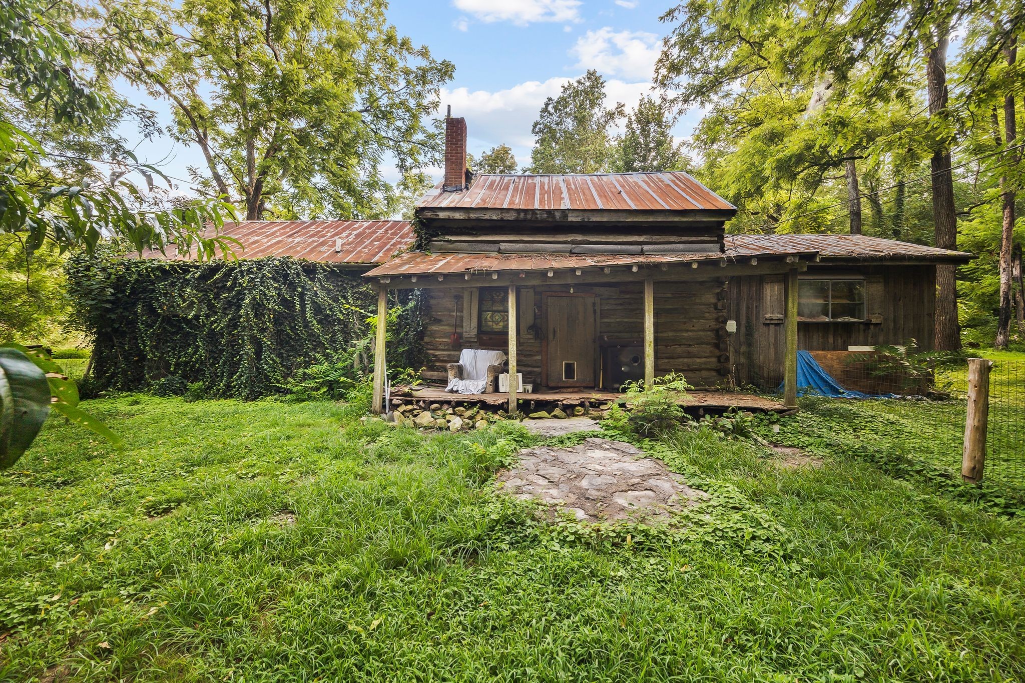 1150 Bell Hollow Road Vanleer, TN 37181 - Photo 26 of 32 a view of a house with backyard and porch