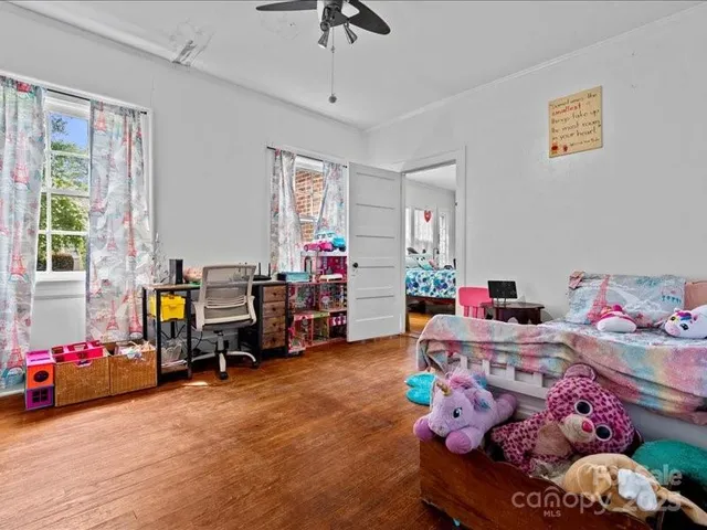 a bed room with furniture and a window