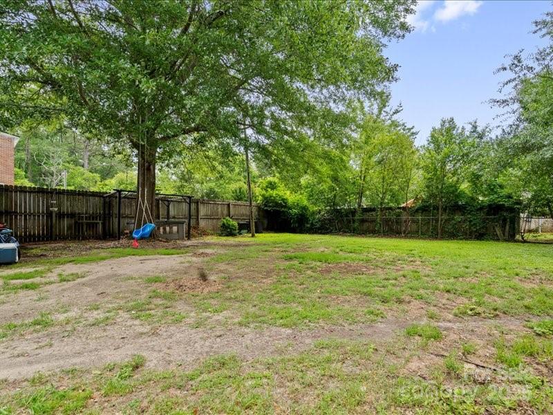 430 3rd Street Cheraw, SC 29520 - Photo 35 of 40 a view of a yard with a house and a large tree